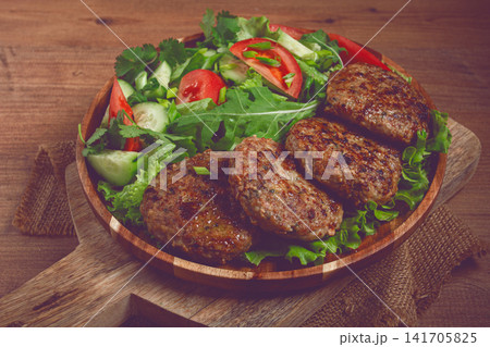 Fried cutlets, mixed minced meat, with vegetable salad, homemade, top view, no people, Fried cutlets, mixed minced meat, with vegetable salad, homemade, top view, no people, 141705825