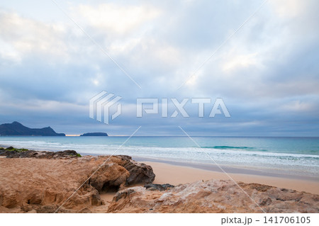 Coastal landscape with wet rocks on the beach of Porto Santo island Coastal landscape with wet rocks on the beach of Porto Santo island 141706105