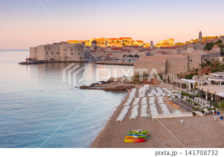 Banje Beach and Old Town Skyline at Sunrise in Dubrovnik Croatia Banje Beach and Old Town Skyline at Sunrise in Dubrovnik Croatia 141708732