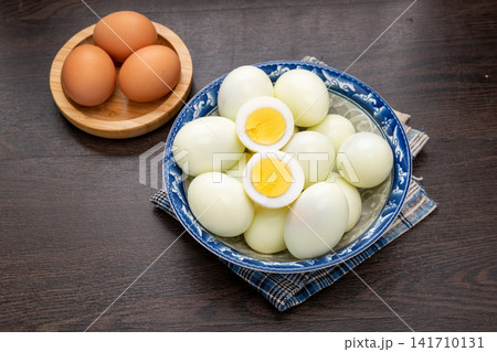 fresh Peeled Hard Boiled Eggs With Whole And Halved Yolks 141710131