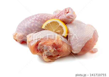 fresh raw chicken drumsticks ready for roasting and grilling 141710755