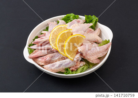 fresh raw chicken wingtips for making rich broth and stock 141710759