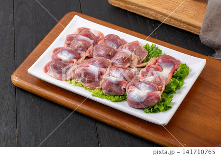 cleaned raw chicken gizzards prepared for stewing and grilling cleaned raw chicken gizzards prepared for stewing and grilling 141710765
