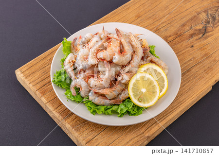 raw headless small sea shrimps with shells intact for cooking 141710857