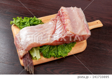raw bighead carp meat portion ready for steaming and broth 141710895