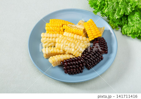 boiled sweet corn segments in three colors served on a plate boiled sweet corn segments in three colors served on a plate 141711416