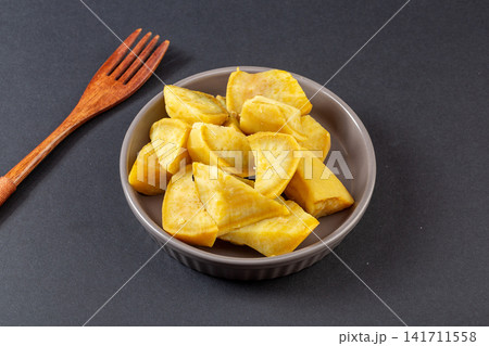 steamed yellow sweet potato chunks served in bowl steamed yellow sweet potato chunks served in bowl 141711558