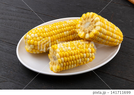 boiled fruit sweet corn cobs and cut segments isolated on white background boiled fruit sweet corn cobs and cut segments isolated on white background 141711699