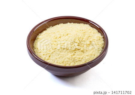 yellow potato flakes and starch powder in ceramic bowl yellow potato flakes and starch powder in ceramic bowl 141711702