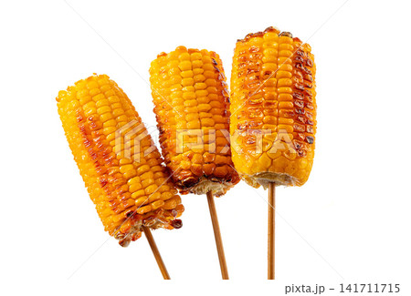 grilled sweet fruit corn segments on skewers 141711715