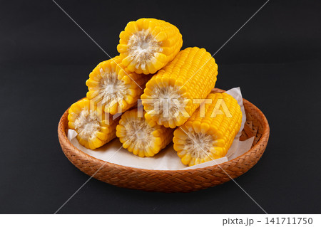 boiled yellow waxy sweet corn cobs stack isolated on white background boiled yellow waxy sweet corn cobs stack isolated on white background 141711750