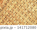 natural woven bamboo mat featuring an authentic handcrafted texture and traditional weaving pattern. This versatile background is ideal for interior design presentations, product photography 141712080