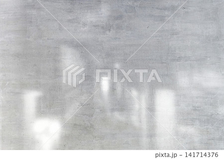 Abstract grey glass window wall background with light shadows and modern professional texture concept. Abstract grey glass window wall background with light shadows and modern professional texture concept. 141714376