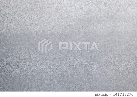Flat textured surface background of a galvanized steel metal sheet with fine silver zinc spangle grain patterns for industrial design projects. High Quality Photo Flat textured surface background of a galvanized steel metal sheet with fine silver zinc spangle grain patterns for industrial design projects. High Quality Photo 141715276