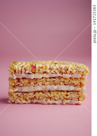 Colorful layered treat on a pink background 141715365