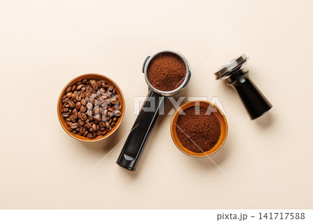 Espresso coffee setup with beans tamper and portafilter top view Espresso coffee setup with beans tamper and portafilter top view 141717588