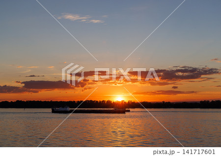 Golden sunset over river landscape Golden sunset over river landscape 141717601