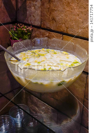Traditional Indonesian Es Teler made with avocado, young coconut, jackfruit, nata de coco, coconut milk, and ice. Refreshing tropical dessert ideal for food, travel, and cultural publications. Traditional Indonesian Es Teler made with avocado, young coconut, jackfruit, nata de coco, coconut milk, and ice. Refreshing tropical dessert ideal for food, travel, and cultural publications. 141717754
