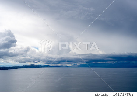 View of Lake Titicaca from Amantani Island under stormy clouds 141717868