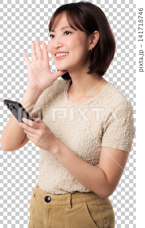 Asian woman waving while holding smartphone with cheerful expression isolated transparent background for friendly 141718746