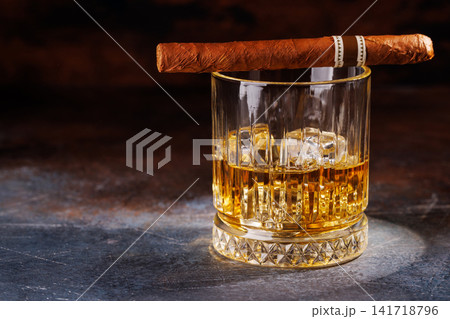 Glass of whiskey with ice and cigar Glass of whiskey with ice and cigar 141718796