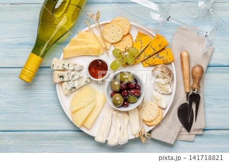 Cheese board with olives grapes and honey Cheese board with olives grapes and honey 141718821