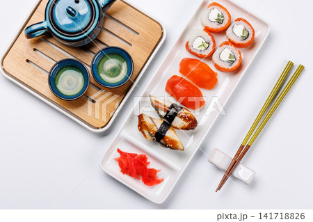 Sushi set with tea and small teapot Sushi set with tea and small teapot 141718826