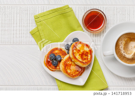 Homemade pancakes with blueberries and syrup Homemade pancakes with blueberries and syrup 141718953