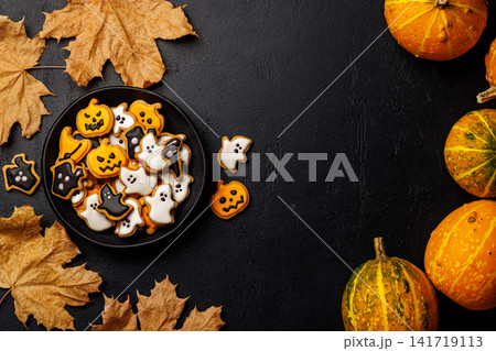 Halloween cookies on black stone background with copy space 141719113