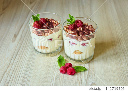 Two Glasses of Homemade Raspberry Tiramisu Dessert Two Glasses of Homemade Raspberry Tiramisu Dessert 141719593