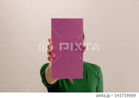 Woman holding a blank square card, communication, identity, messaging Woman holding a blank square card, communication, identity, messaging 141719809