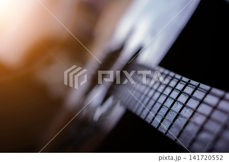 Guitar melody with expressive chords and solo performance creating emotional musical atmosphere. Guitar melody with expressive chords and solo performance creating emotional musical atmosphere. 141720552