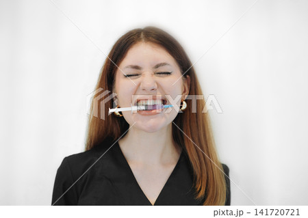 skilled aesthetician woman professional wearing black medical suit holding syringes skilled aesthetician woman professional wearing black medical suit holding syringes 141720721