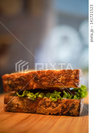 Rustic Artisan Sandwich with Fresh Lettuce on Wooden Table Healthy Lunch Food Photography Rustic Artisan Sandwich with Fresh Lettuce on Wooden Table Healthy Lunch Food Photography 141721523