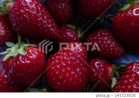 Fresh strawberries on a plate close-up Fresh strawberries on a plate close-up 141723010