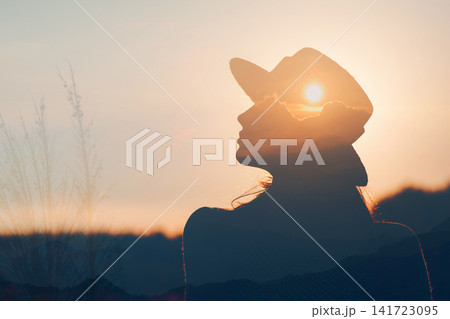 Positive woman enjoys harmony inner peace and awareness in nature experience. Peaceful calmness freedom and mindfulness of mind concept. Positive woman enjoys harmony inner peace and awareness in nature experience. Peaceful calmness freedom and mindfulness of mind concept. 141723095