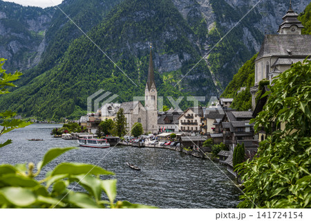 Hallstatt village with its church on the lake in Salzkammergut, Upper Austria, suitable as a calm wallpaper or background. 141724154