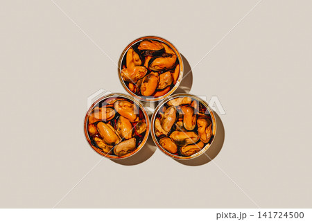 top view of three tins of mejillones en escabeche top view of three tins of mejillones en escabeche 141724500