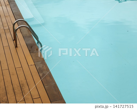 Poolside Ladder and Steps in Turquoise Water Poolside Ladder and Steps in Turquoise Water 141727515