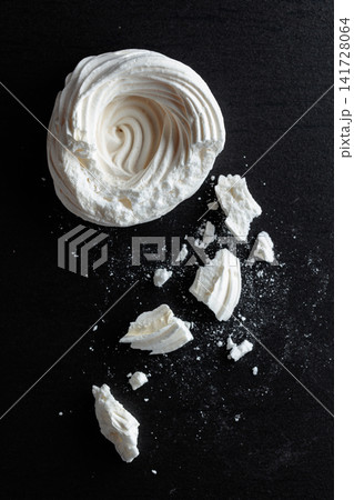 Broken meringue for making mini Pavlova desserts. 141728064