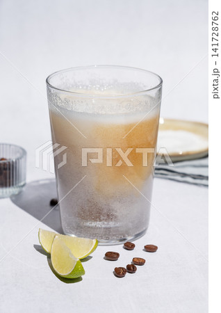 Coffee bomb with sparkling water and espresso shot, trendy summer coffee drink Coffee bomb with sparkling water and espresso shot, trendy summer coffee drink 141728762
