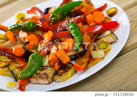 Plaque is tasty dish of Bulgarian cuisine with baked vegetable Plaque is tasty dish of Bulgarian cuisine with baked vegetable 141729030