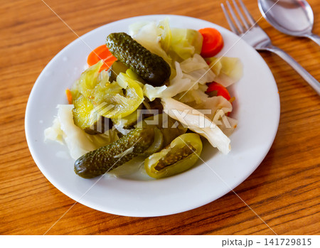 Turkish pickles made with cucumber, cabbage and carrots closeup Turkish pickles made with cucumber, cabbage and carrots closeup 141729815