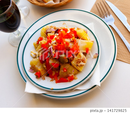 Salad with boiled potatoes, eggs, canned tuna, olives, bell peppers, onions Salad with boiled potatoes, eggs, canned tuna, olives, bell peppers, onions 141729825