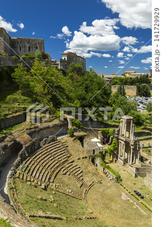 Roman theater ruins contrasting historic Volterra, Tuscany, Italy 141729929
