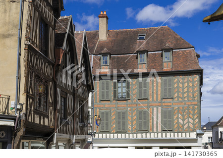 Traditional half timbered houses lining Auxerre street in France Traditional half timbered houses lining Auxerre street in France 141730365