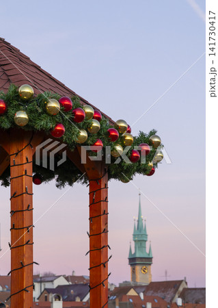 Christmas market stall decorating the Znojmo cityscape at dusk Christmas market stall decorating the Znojmo cityscape at dusk 141730417