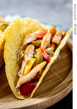 Mexican chicken tacos with bell peppers and onions 141731341