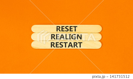 Reset realign restart words symbol. Concept words Reset realign restart on beautiful wooden sticks. Beautiful orange background. Business motivational and reset realign restart concept. Copy space. Reset realign restart words symbol. Concept words Reset realign restart on beautiful wooden sticks. Beautiful orange background. Business motivational and reset realign restart concept. Copy space. 141731512