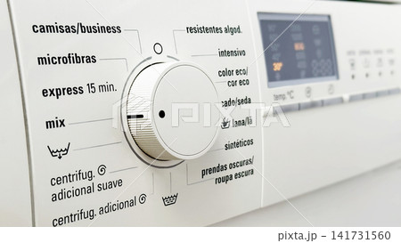 Washing Machine Control Dial with Laundry Programs and Digital Display Close Up Washing Machine Control Dial with Laundry Programs and Digital Display Close Up 141731560